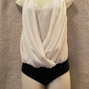 Overlay-top bodysuit.